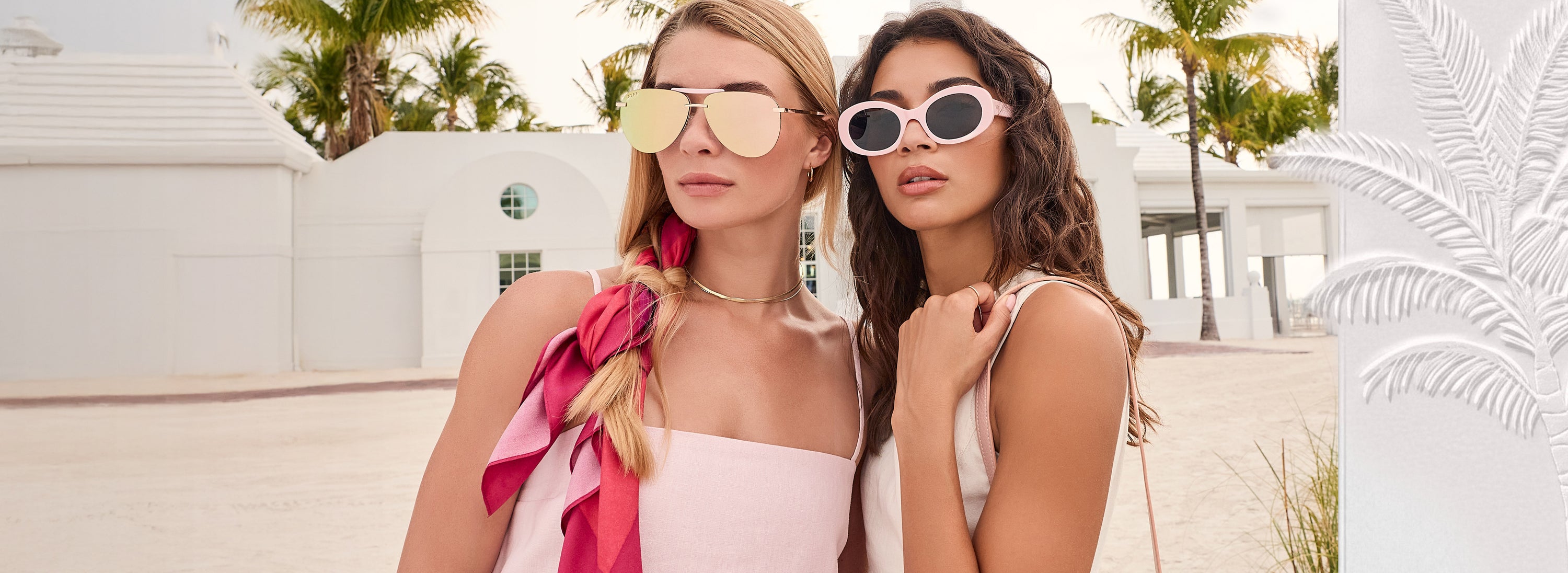 Brunette and blonde model wearing pink pastel outfits and mirrored aviator sunglasses and pastel pink sunglasses