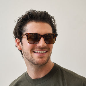 lifestyle - tylerhayek wearing diff eyewear featuring the billie square sunglasses with a rich tortoise frame and brown polarized lenses front view