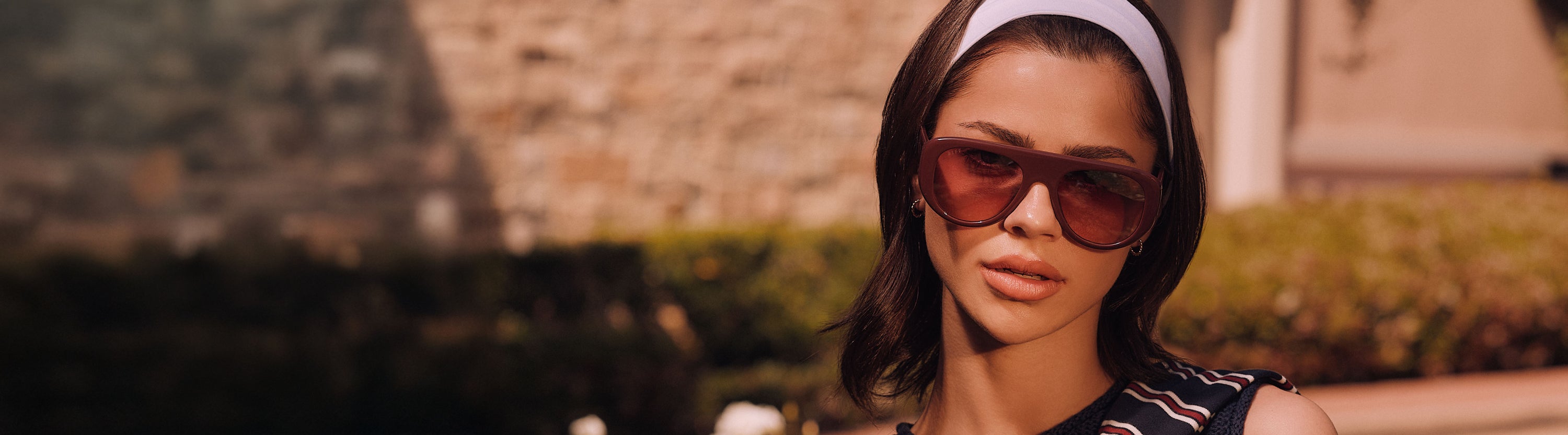 Video of blonde at country club with prep fashion and oversized square ivory sunglasses