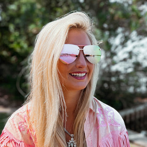 lifestyle - ambermiller9 wearing diff eyewear tahoe aviator sunglasses with a rose gold frame and cherry blossom mirror lenses