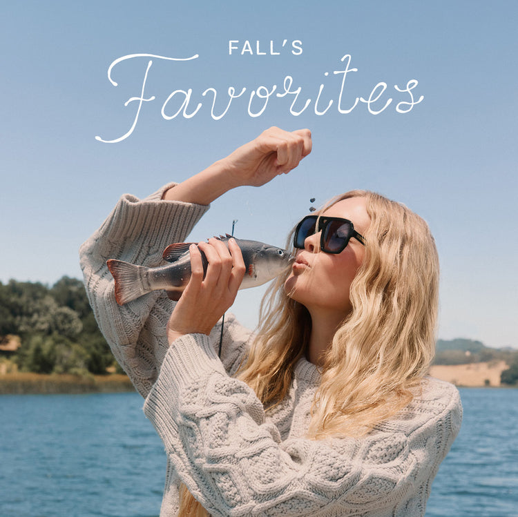 Blonde woman in grey cardigan lakeside cabin fashion