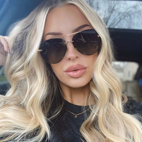 model wearing aviator sunglasses