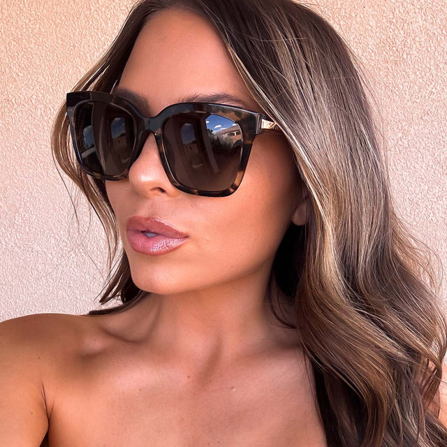 customer content - female wearing diff eyewear bella square sunglasses with a espresso tortoise frame and grey gradient polarized lenses