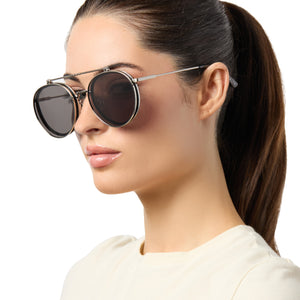 on model - female wearing star wars x diff eyewear anakin™️ podracer™️ round prescription glasses with a galactic brushed silver metal frame and flip up space grey lenses angled view