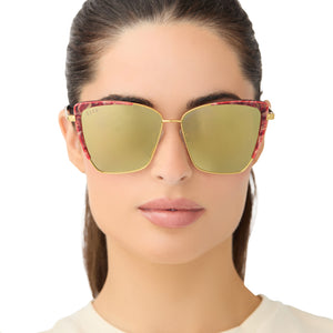 on model - female wearing star wars x diff eyewear queen amidala oversized cat eye sunglasses with a marbled naboo royal red with hammered gold frame and gold mirror polarized lenses front view