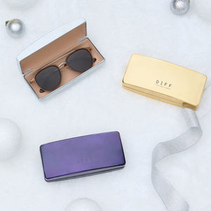 lifestyle - diff eyewear group shot of hard chrome cases in silver, gold, and purple