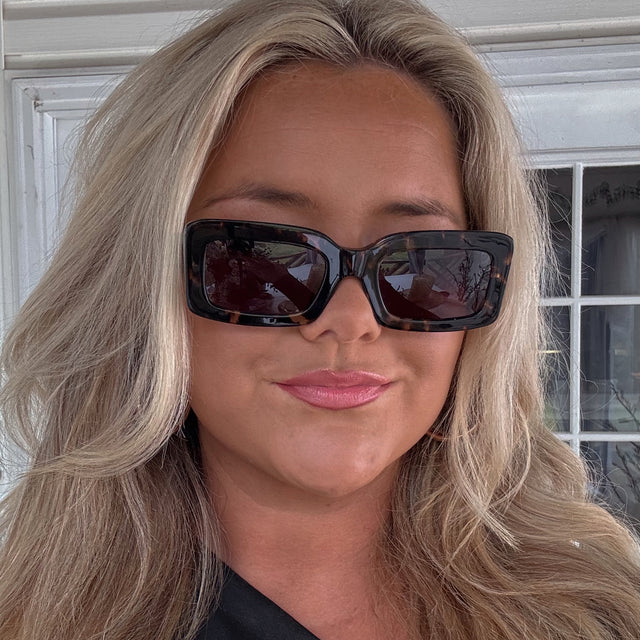 customer content - female wearing diff eyewear indy rectangular sunglasses with a espresso tortoise acetate frame and grey lenses front view