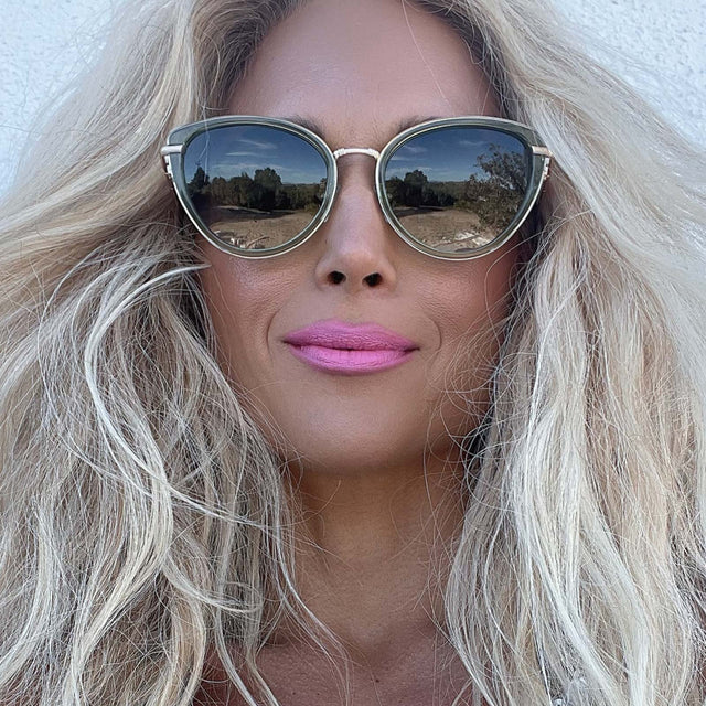 customer content - obsessedandyouneedit wearing star wars x diff eyewear princess leia™ endor™ cat eye sunglasses with a transulucent sage green acetate and gold metal frame with endor forest moon green polarized lenses front view