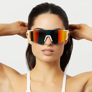 on model - female wearing diff sport heat shield sunglasses with a matte white frame and sunset mirror polarized lenses front view
