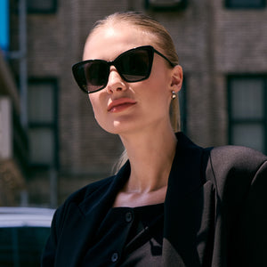 on model - female wearing diff eyewear becky ii black frame dark smoke polarized sunglasses front view