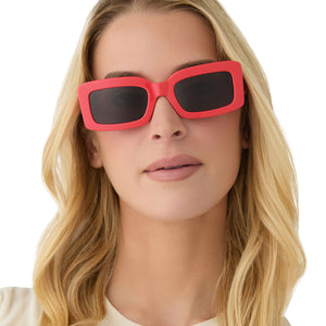 on model - female wearing diff eyewear featuring the indy rectangle sunglasses with a sunset bright coral frame and grey lenses front view