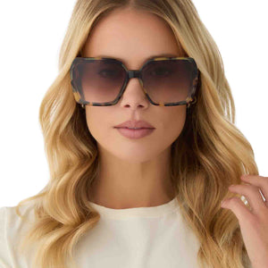 on model - female wearing diff eyewear featuring the presley square sunglasses with a brown kombu frame and brown gradient lenses front view