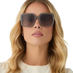 on model - female wearing diff eyewear featuring the sandra square sunglasses with a london stone frame and truffle gradient lenses front view