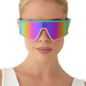 on model - female wearing diff sport featuring the spike shield sunglasses with a turquoise & hot pink frame and pink rush mirror polarized lenses front view