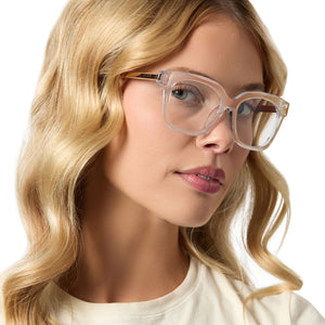 on model - female wearing diff eyewear bella xs square prescription glasses with a opalescent pink frame angled view