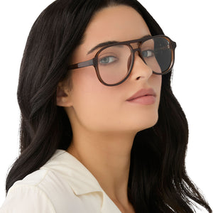on model - female wearing diff eyewear featuring the tatum aviator blue light readers with a whiskey crystal frame angled view
