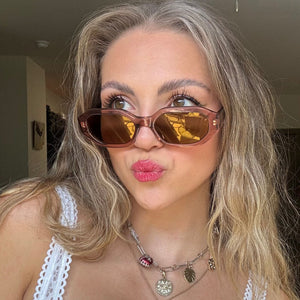 lifestyle - niki maragos blonde influencer wearing low profile nude brown sunglasses with silver accessories