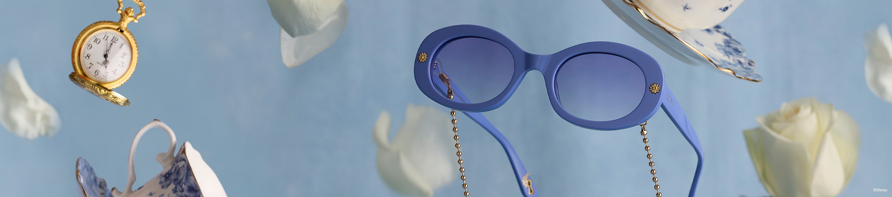 Blue Alice in Wonderland sunglasses floating among pocket watch and teacup