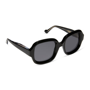 iconica x diff eyewear gisele round sunglasses with a black acetate frame and grey polarized lenses angled view