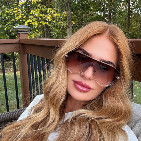 brookeh melton wearing imani shield brown sunglasses on sundeck
