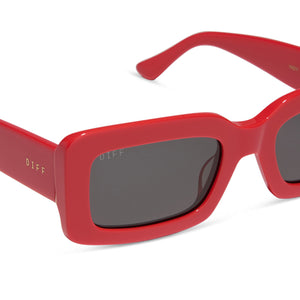 diff eyewear featuring the indy rectangle sunglasses with a sunset bright coral frame and grey lenses detailed view