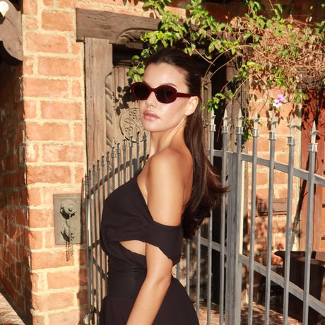 stephanie brightt brunette influencer wearing oval shape sunglasses with brown dress