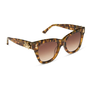 the white lotus x diff eyewear featuring the hawaii cat eye sunglasses with a coconut palm tortoise frame and brown gradient lenses angled view tropical hardware