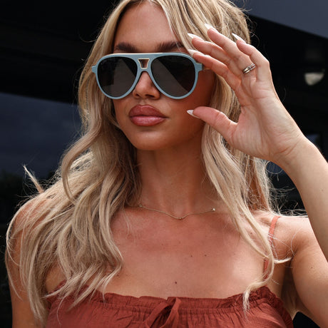 lifestyle - ashley smith wearing tosca iii dew drop soft blue aviators with brown top