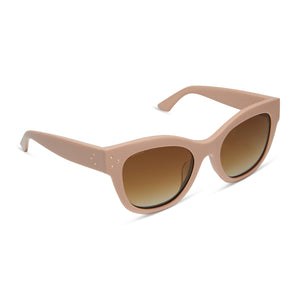 iconica x diff eyewear eva cat eye sunglasses with a nude peach frame and brown gradient polarized lenses angled view