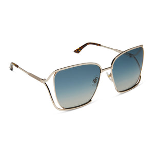 iconica x diff eyewear francesca square oversized sunglasses with a champagne metal frame and paradiso blue polarized lenses angled view