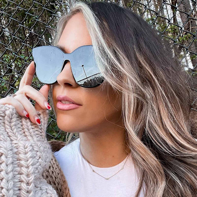 customer content - female wearing diff eyewear gia round sunglasses with a black frame and grey lenses