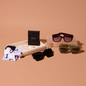 DIFF Eyewear Iconica Holiday Bundle featuring the Iconica Daniella Python in Black, the Dania Crimson, Maren Python Olive and diff eyewear cleaning kit