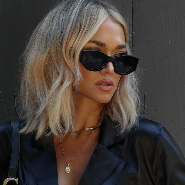 customer content - female wearing diff eyewear zoe oval sunglasses black frame with grey polarized lenses