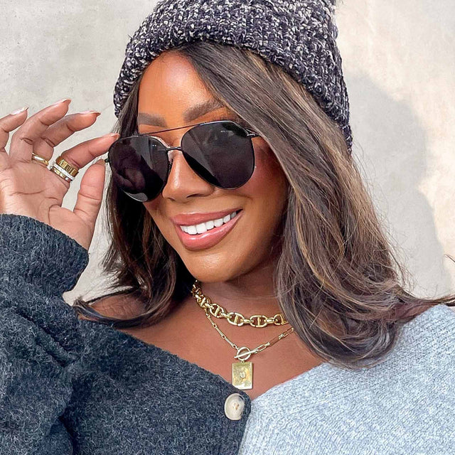 customer content - female wearing dash aviator sunglasses with a matte black metal frame and solid grey polarized lenses