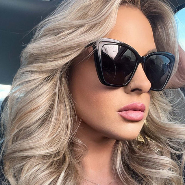 customer content - blonde female wearing diff eyewear becky ii black frame dark smoke polarized sunglasses