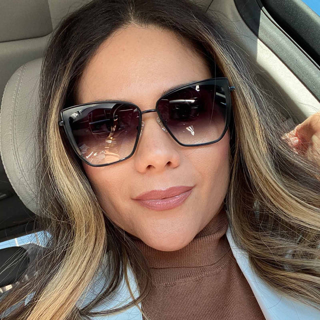 customer content - female wearing grace cat eye sunglasses with a black frame and grey gradient sharp lenses