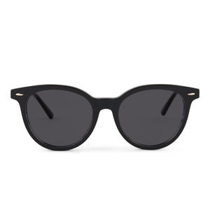 patricia nash x diff eyewear blondie round sunglasses with a black acetate frame and grey lenses front view